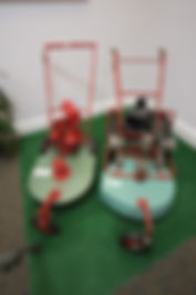 Prototype Kee Lawnmower on the left and manufactured Kee Mower on the right. Located in the Horticulture Room.