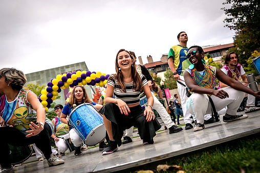 People on stage dancing in celebration