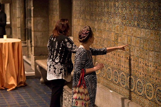 people touching display wall