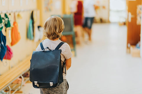 Child with school backpack