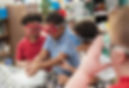 Elementary students performing science experiements