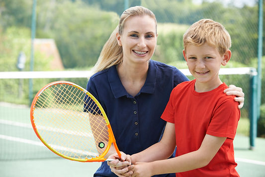 Boy with Tennis Coach