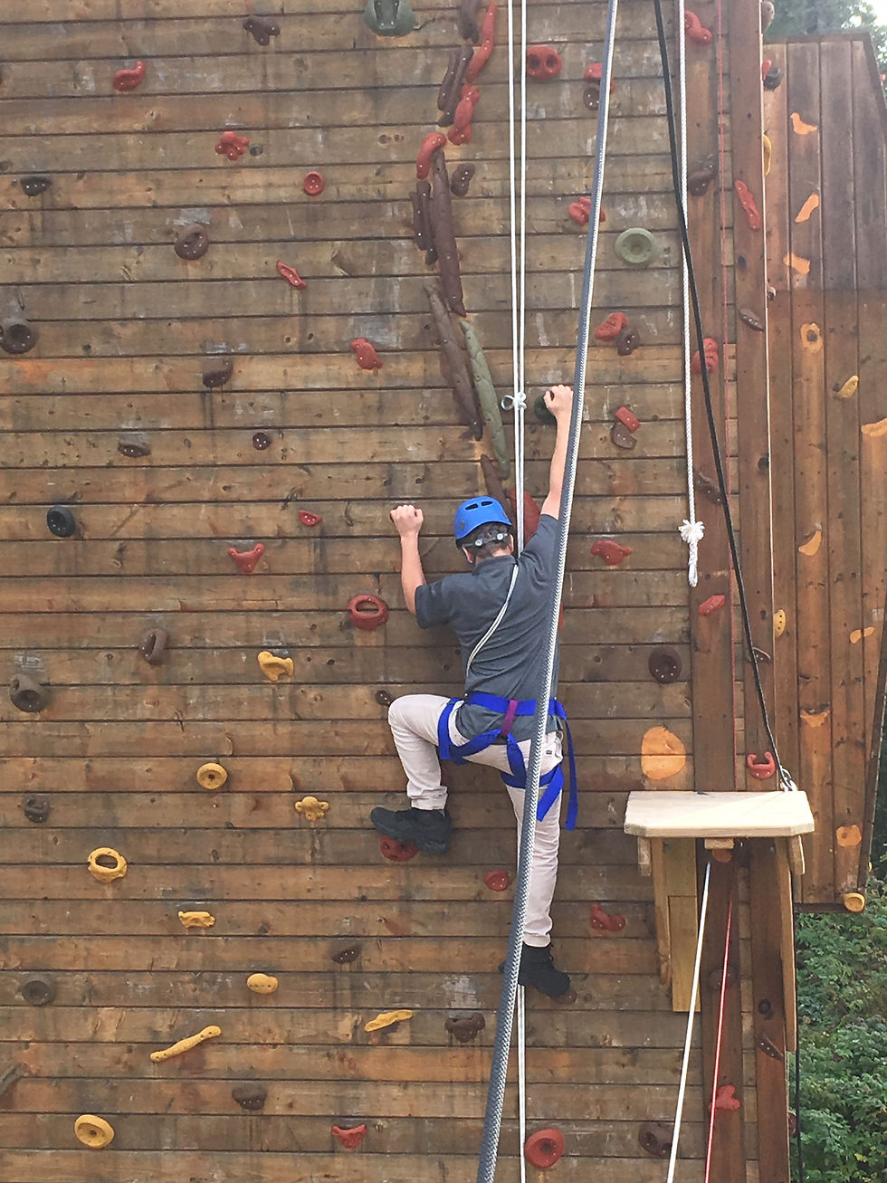 Reaching for new heights on the climbing wall.