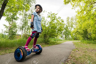 125419185-a-little-girl-riding-a-electric-self-balancing-scooter-child-is-balancing-on-a-g