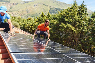 169381773-workers-assemble-energy-system-with-solar-panel-for-electricity-and-hot-water.jp