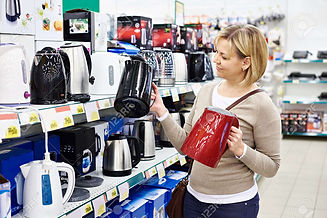 39598439-woman-housewife-shopping-for-electric-kettle-smiling.jpg