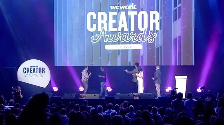 receiving a wework community giver award at creatorawards israel 2017
