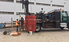 Truck-mounted drill-rig on project site