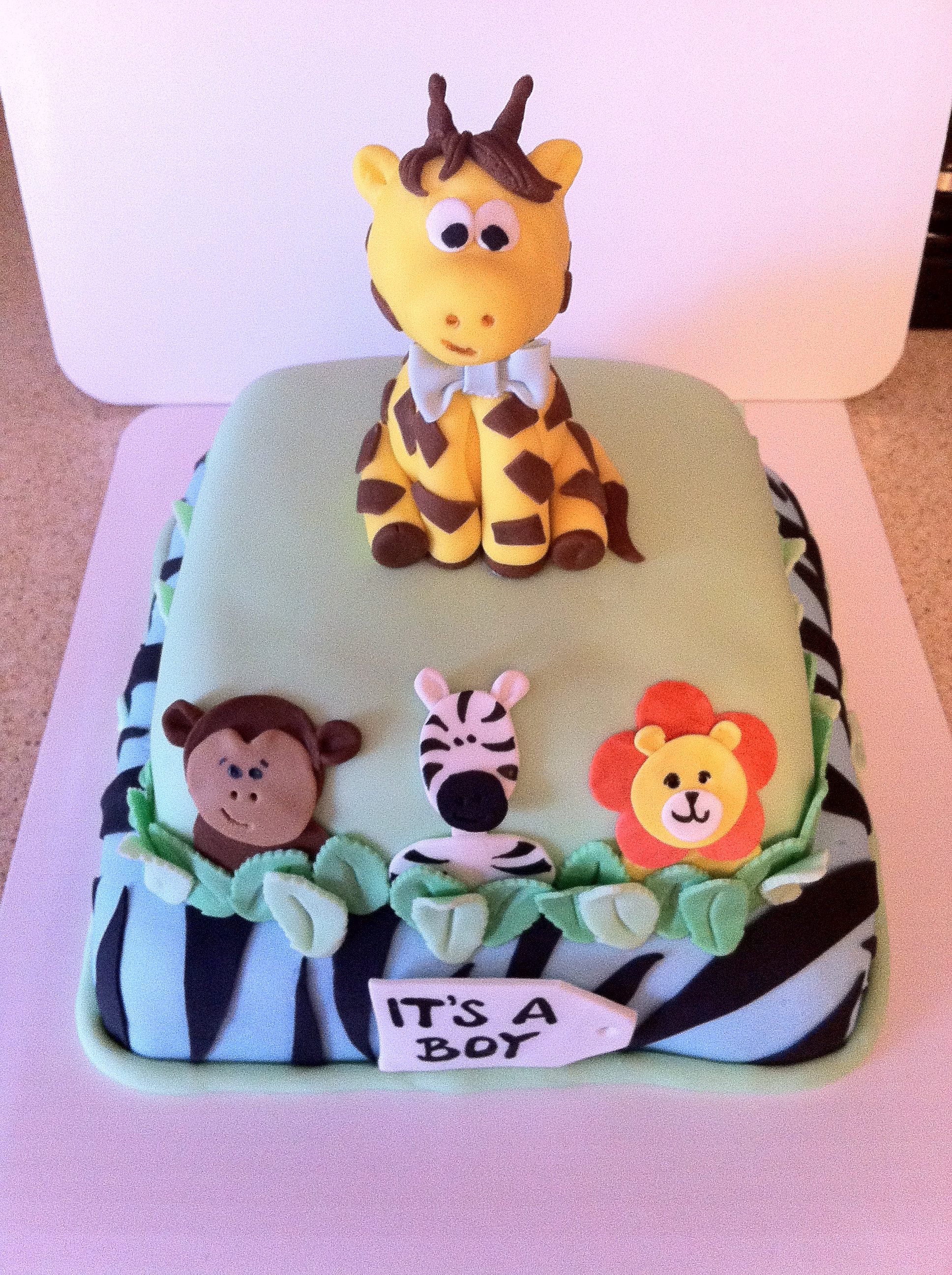 For one wild baby shower! Two-tier, fondant covered cake with fondant ...