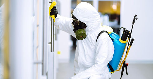 person-wearing-hazmat-suit-disinfecting-