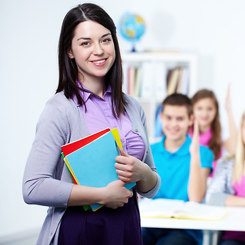 happy-teacher-with-students-background.jpg