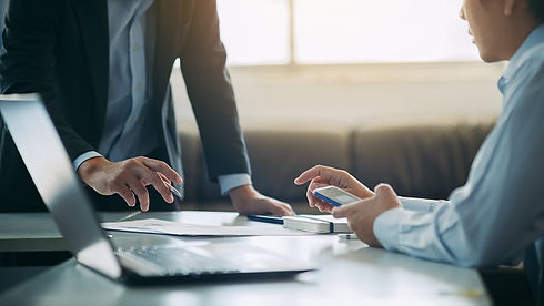 two-businessman-analyzing-company-financial-report (2).jpg