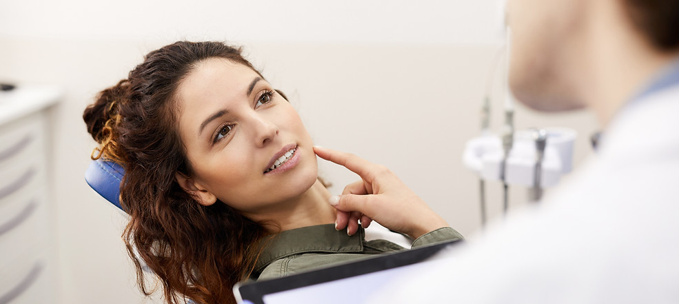 young-woman-consulting-dentist-2021-09-24-03-54-47-utc.jpeg