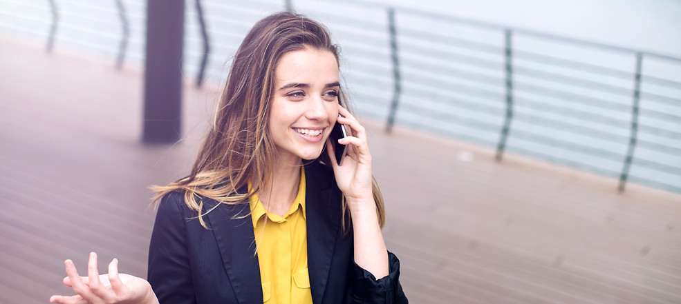 young-business-woman-uses-cellphone-at-the-street-2022-04-13-00-13-14-utc.jpeg