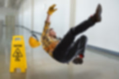 Worker falling on wet floor inside build