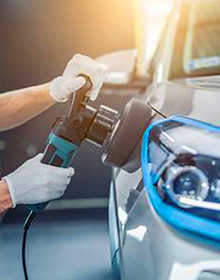 82172155-car-detailing-man-holds-a-polis