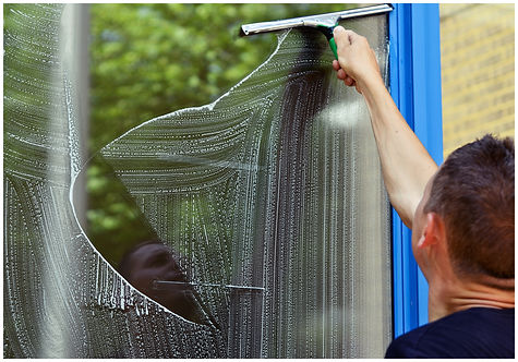 Man cleaning window using Window Cleanin