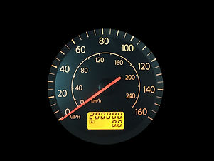 High Mileage Odometer Isolated on Black.