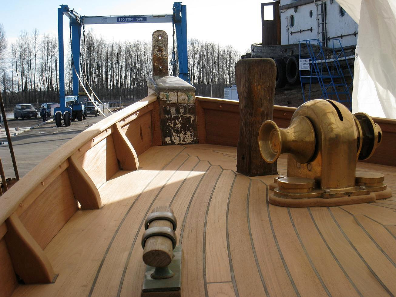 New bulwarks and teak decking meet at the 75 year-old, grown-oak stem ...