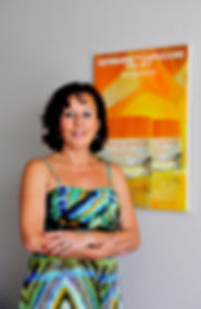 I am Tatyana standing in my cozy home Office next to Germaine De Capuccini Royal Jelly Poster