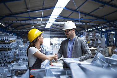 factory-manager-visiting-production-line-and-congratulating-worker-on-promotion-for-hard-w