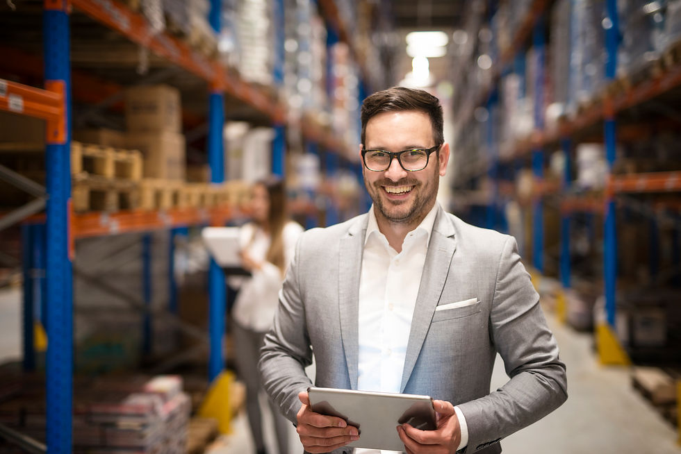 portrait-of-successful-middle-aged-manager-businessman-holding-tablet-computer-in-large-wa