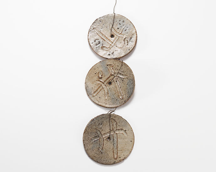 Hanging rounds with symbols c.1975