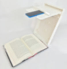 ScanJig stand oriented for book scanning showing a novel being scanned
