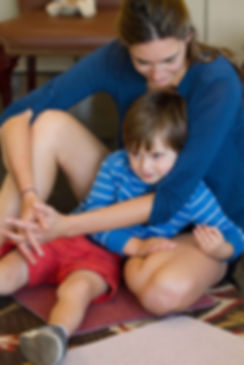 boy in mom's lap