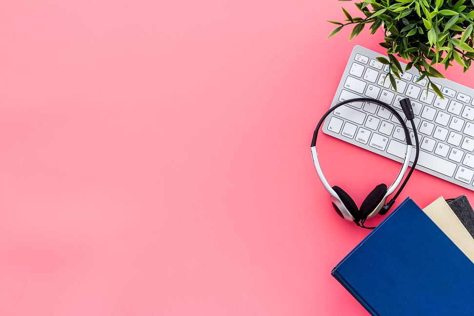 E-learning, online course. Computer, book and headphones on pink background from above cop