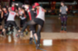 roller girl playing roller derby on roller skates