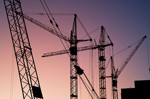 crane with purple sky behind it Image by Artem Labunsky