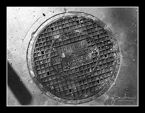 city street, sewer cover