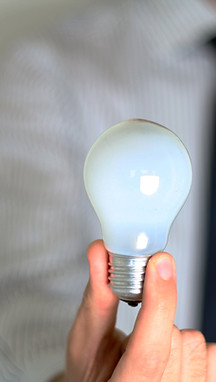 Hand Holding Bulb