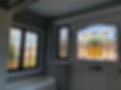 Stained glass door and windows in an entryway