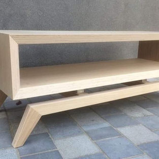 Minimalist wooden TV unit with open storage shelves