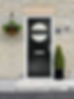 A modern black door with a circular window and mail slot, set in a stone wall