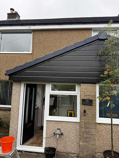Front view of a modern house with a gabled roof porch