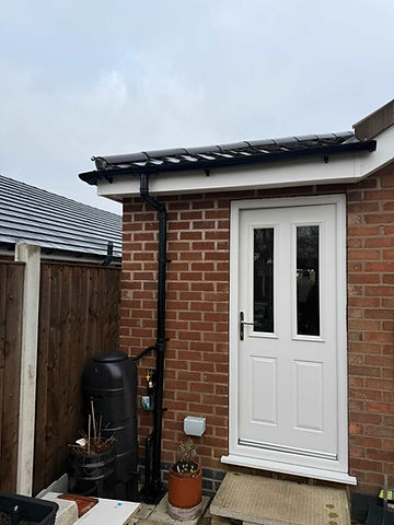 White uPVC front door installed on brick exterior wall