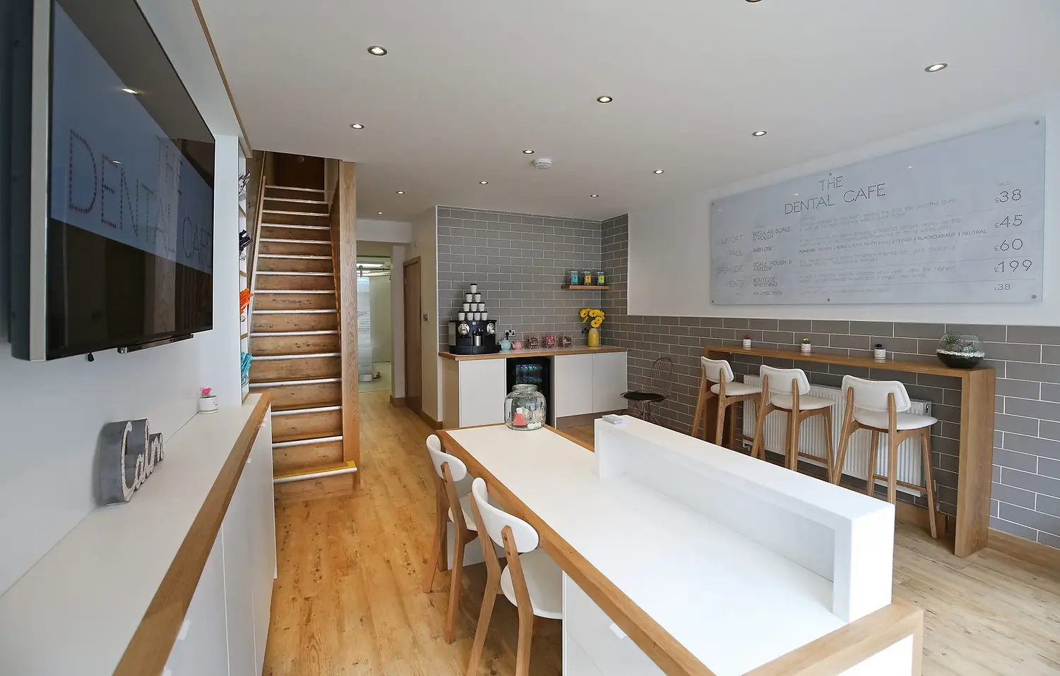 Modern dental cafe interior with wooden floors, gray brick walls
