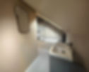 Modern attic bathroom with a sloped ceiling
