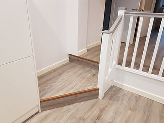 staircase with white railings