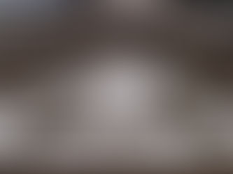 Royal coat of arms carved in stone on a UK government building, featuring the lion and unicorn — are government bonds safe when the state itself has a centuries-old playbook for eroding their value?