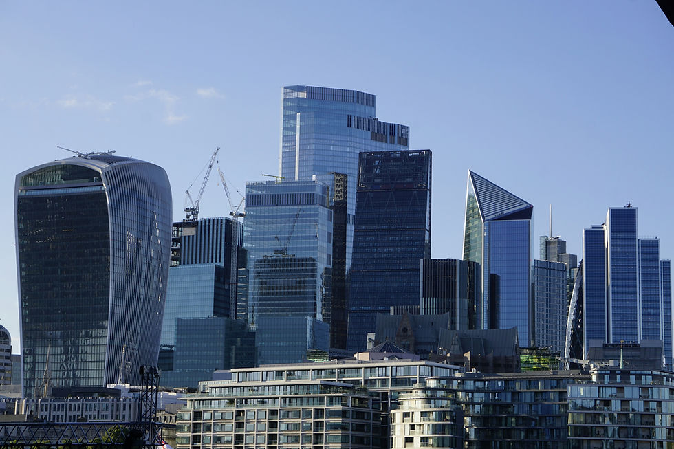 Glass and steel office towers in London's financial district, where the asset management firms regulated by the FCA asset management reforms operate