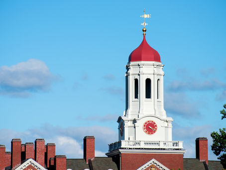 Dunster House clock tower at Harvard University. Harvard's $50 billion endowment is among many American charitable institutions that consistently underperform simple, low-cost index fund strategies despite access to sophisticated investment resources.