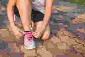 Picture of women tying the laces on her running shoes