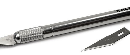 A close-up of a silver X-Acto knife