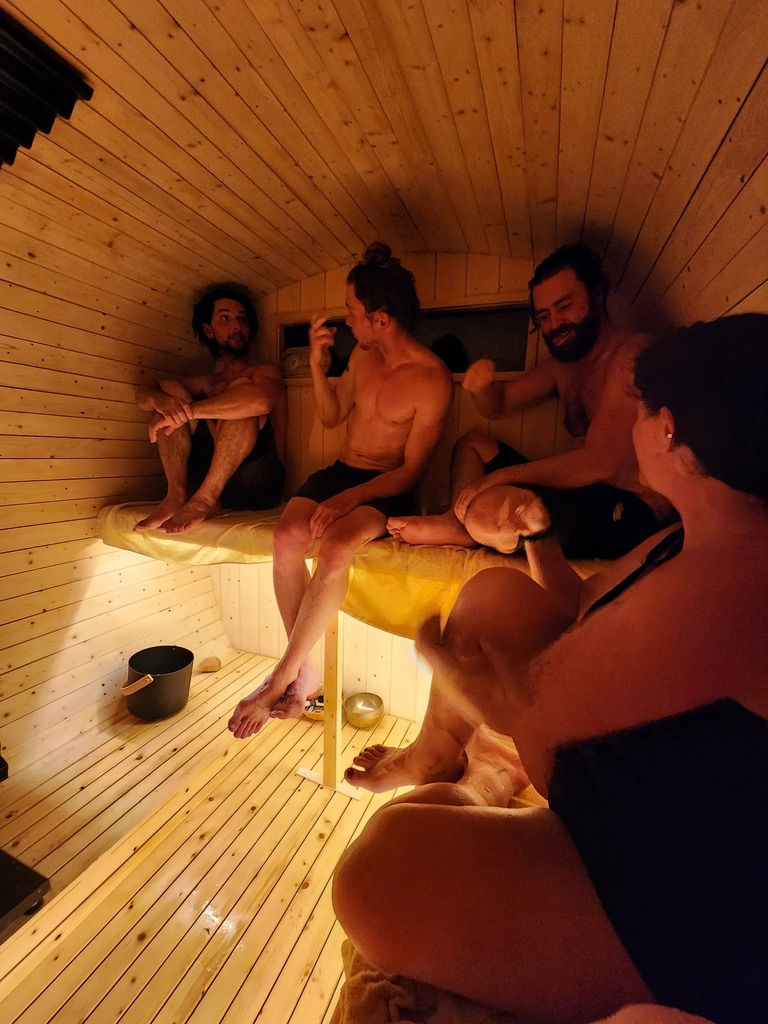 Group enjoying a Newfoundland luxury sauna experience. Interior of 6 person sauna.