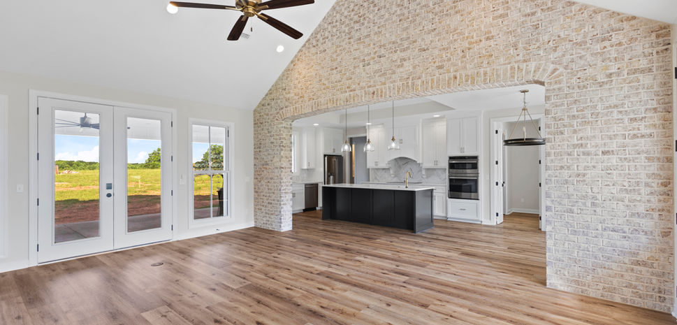 Light brick accent wall creates character and brings texture into this living room