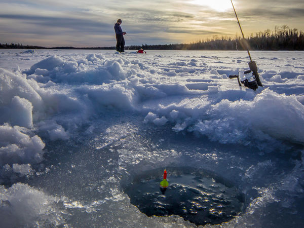 A man ice fishing